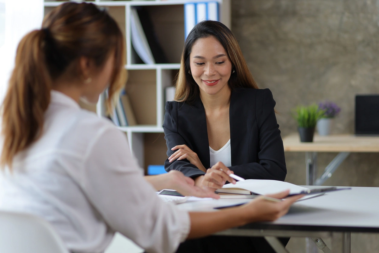 Female manager in office discussing and interviewing job applicant for new employees